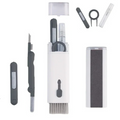 Kit 7 em 1 de escovas de limpeza para teclado, fone e celular na cor cinza, com acessórios multifuncionais.