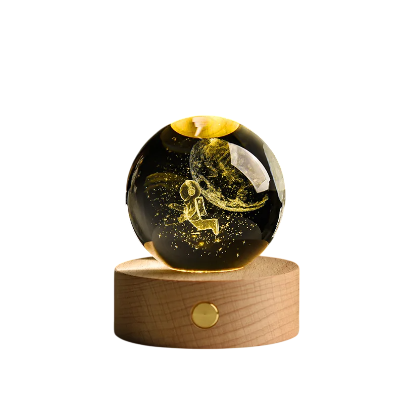Luminária Decorativa com astronauta voando próximo à lua dentro de uma bola iluminada - Modelo U